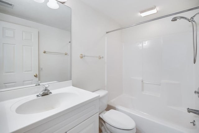 bathroom featuring visible vents, shower / bathing tub combination, toilet, and vanity