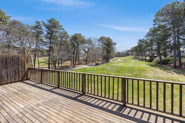 wooden terrace with a lawn