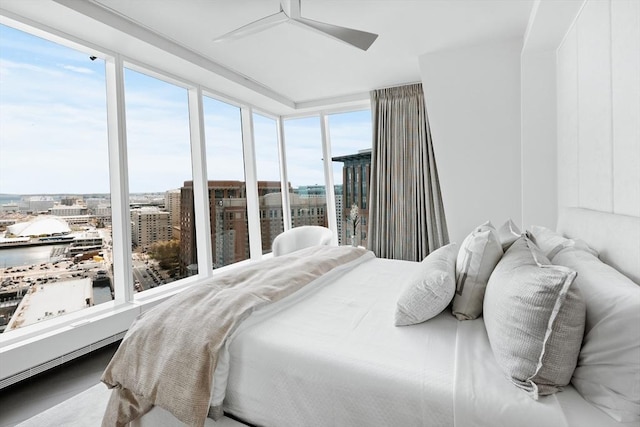 bedroom featuring multiple windows and ceiling fan