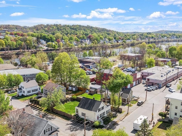birds eye view of property with a water view and a residential view