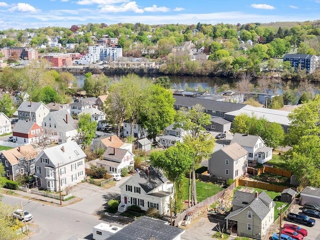 drone / aerial view featuring a water view and a residential view