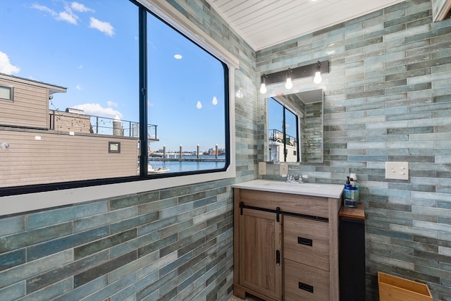 bathroom with vanity and a water view