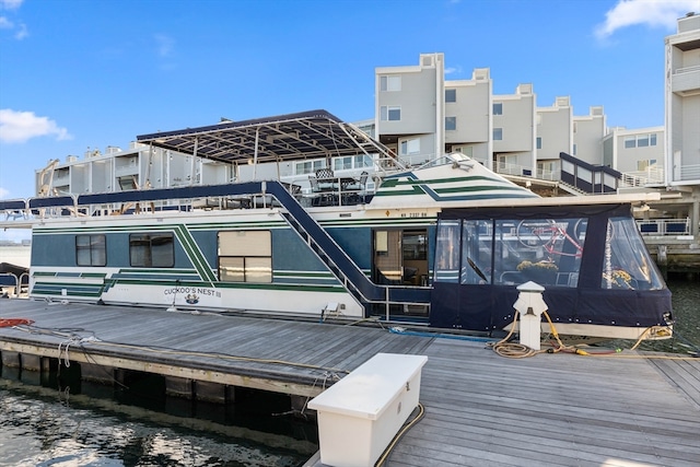 back of property featuring a water view