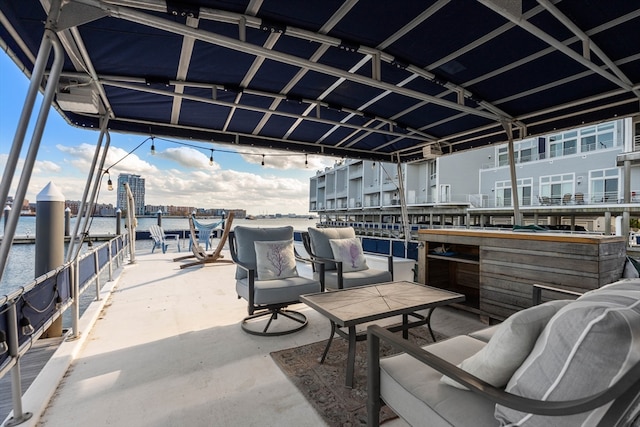 view of patio / terrace featuring an outdoor living space and a water view