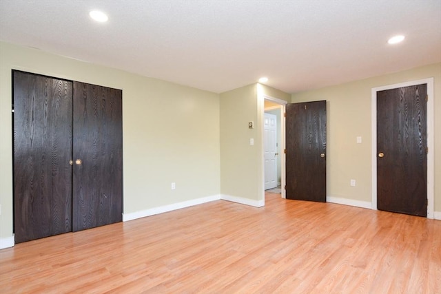 1186 Worcester Rd Unit 1221, Framingham, MA 01702 - unfurnished bedroom featuring light wood finished floors, recessed lighting, and baseboards