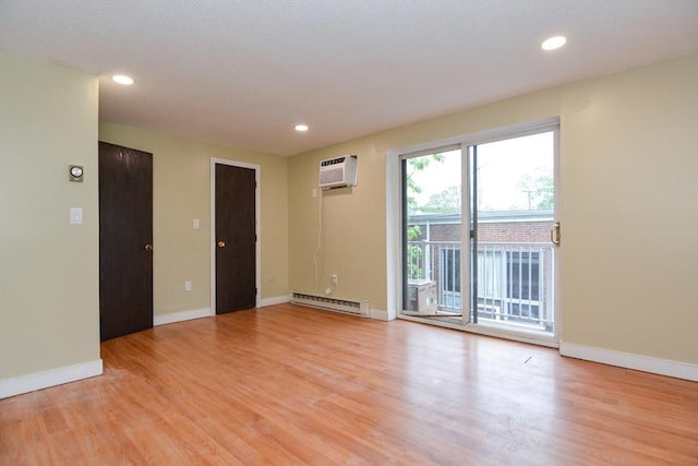 1186 Worcester Rd Unit 1221, Framingham, MA 01702 - unfurnished room with baseboard heating, light wood finished floors, recessed lighting, and baseboards