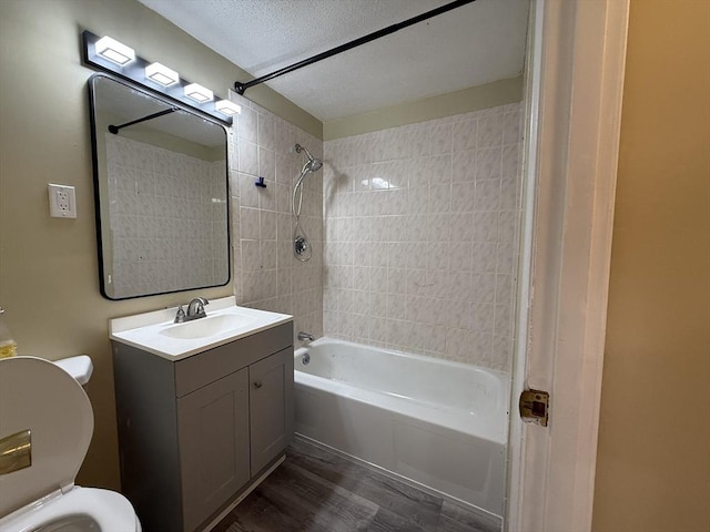 1186 Worcester Rd Unit 1221, Framingham, MA 01702 - bathroom with toilet, tub / shower combination, wood finished floors, vanity, and a textured ceiling