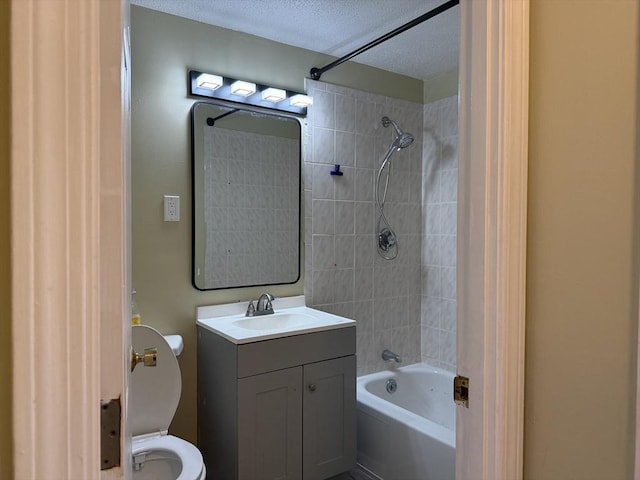 1186 Worcester Rd Unit 1221, Framingham, MA 01702 - bathroom featuring toilet, washtub / shower combination, a textured ceiling, and vanity