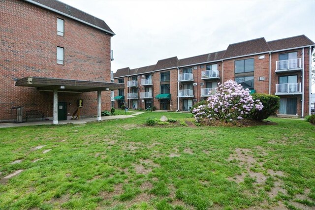 1186 Worcester Rd Unit 1221, Framingham, MA 01702 - view of grassy yard featuring a patio