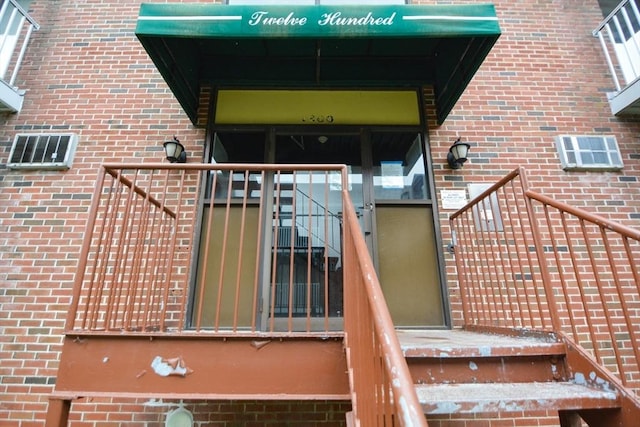 1186 Worcester Rd Unit 1221, Framingham, MA 01702 - doorway to property with brick siding