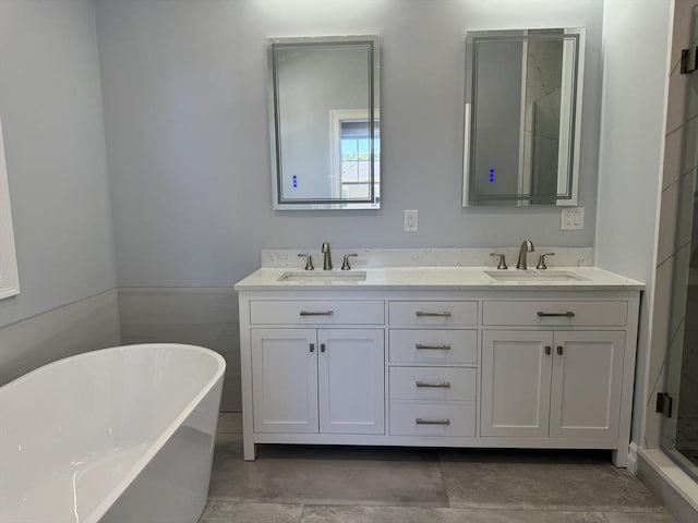 bathroom with vanity and separate shower and tub