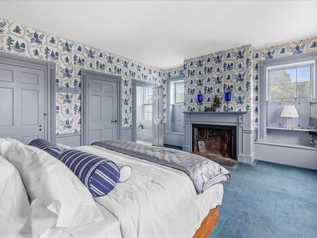 bedroom featuring multiple windows and carpet flooring