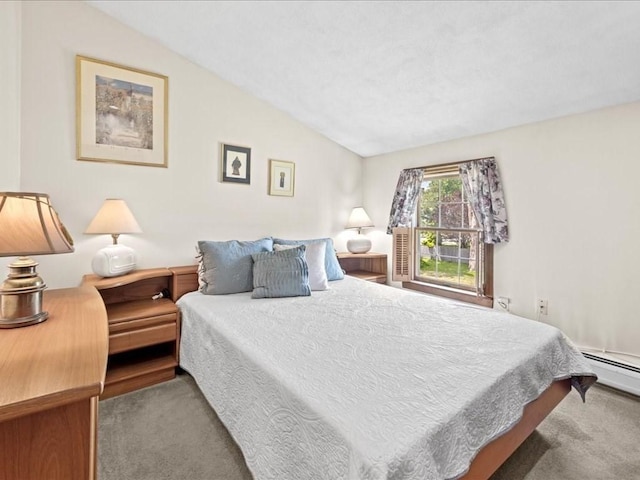 carpeted bedroom with lofted ceiling and a baseboard radiator