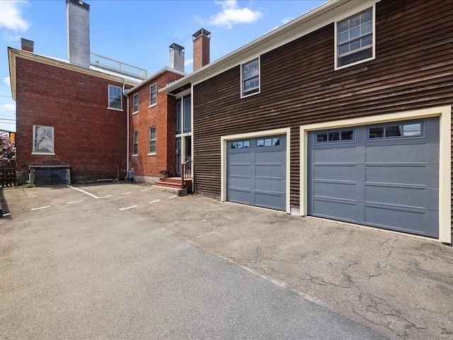 exterior space with a garage