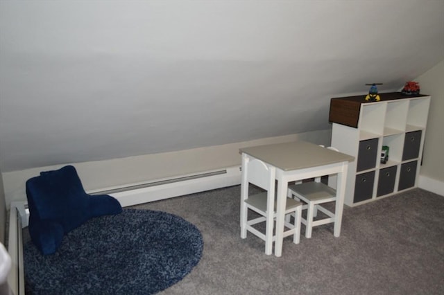carpeted office space with lofted ceiling and a baseboard radiator