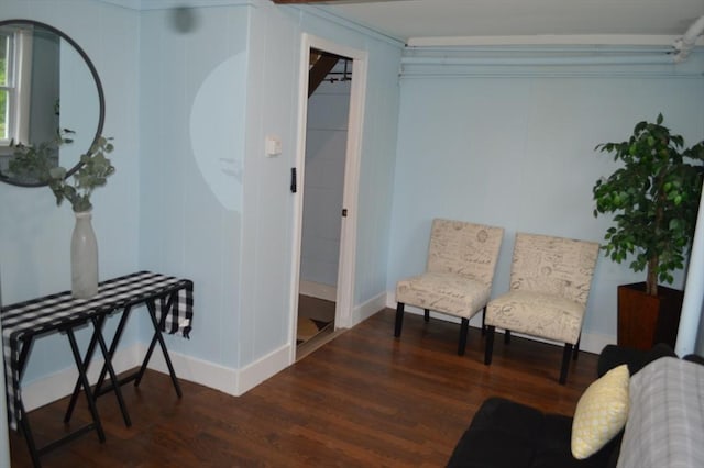 living area featuring wood finished floors and baseboards