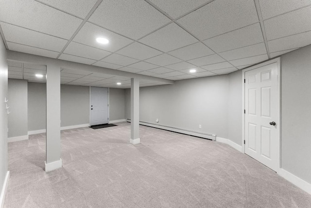 finished below grade area with recessed lighting, a baseboard heating unit, and carpet