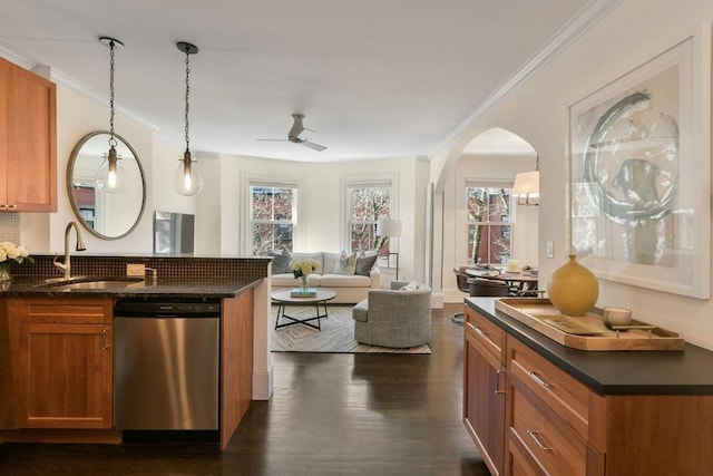 kitchen featuring a sink, crown molding, brown cabinetry, and dishwasher