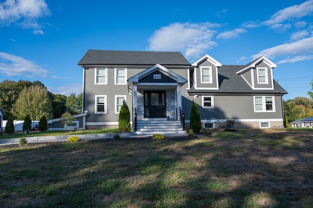 view of front of property featuring a front yard