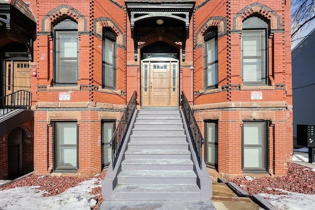 entrance to property with brick siding