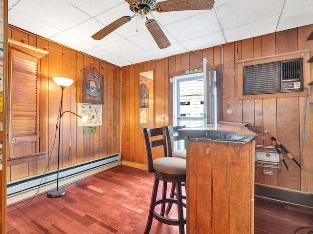 110 Reed St, Cambridge, MA 02140 - kitchen with wood walls, a baseboard radiator, a drop ceiling, ceiling fan, and baseboards