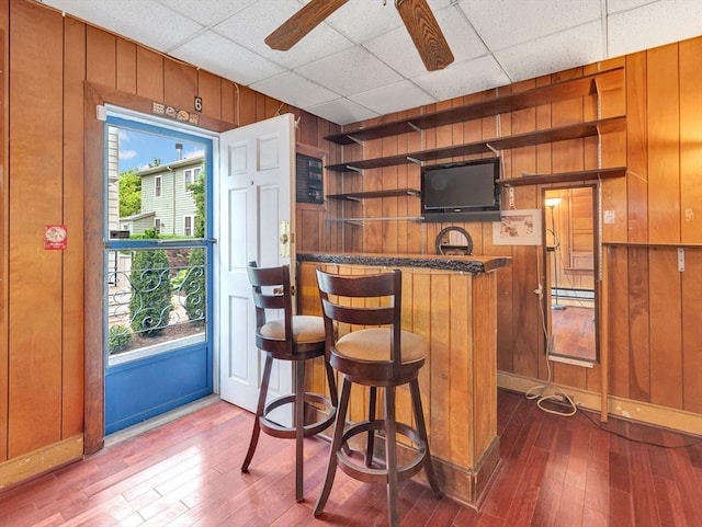 110 Reed St, Cambridge, MA 02140 - indoor wet bar featuring wooden walls, plenty of natural light, dark wood-type flooring, and ceiling fan