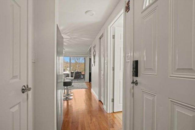 hall with light wood-style floors