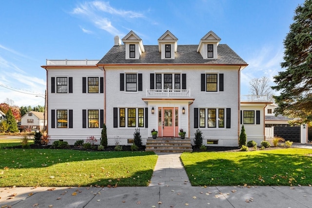 colonial inspired home with a front yard