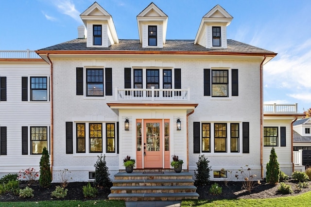 view of front of property with a balcony