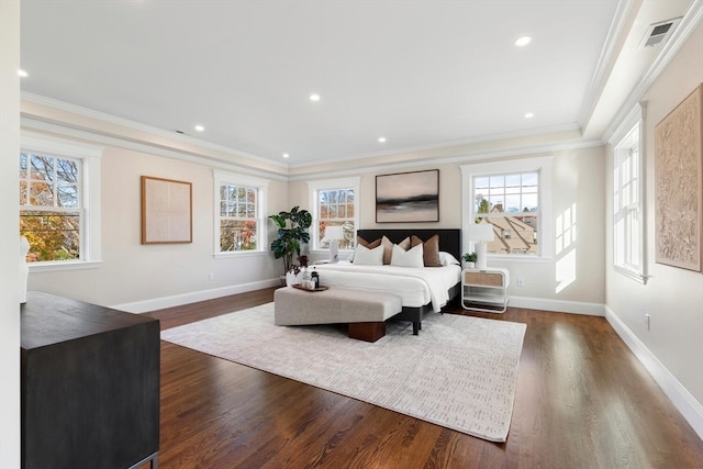 bedroom with dark hardwood / wood-style flooring, multiple windows, and crown molding