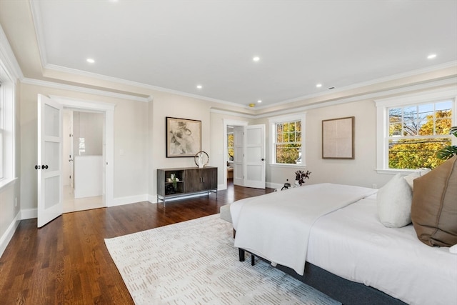 bedroom featuring ornamental molding and dark hardwood / wood-style flooring