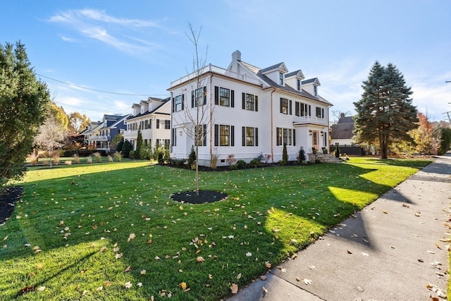 view of front facade featuring a front yard