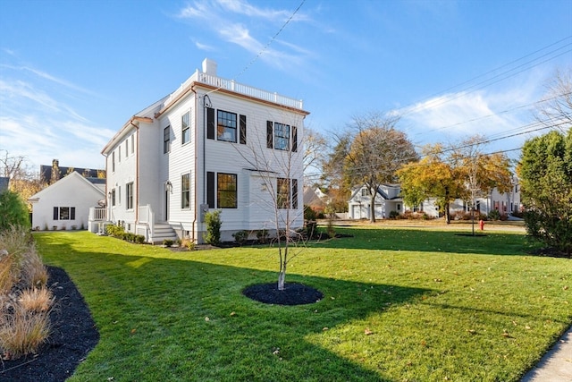 view of home's exterior with a lawn