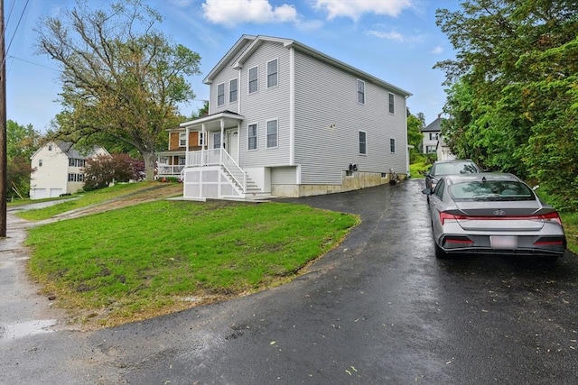 517 Primrose St, Haverhill, MA 01830 - view of side of property featuring a yard