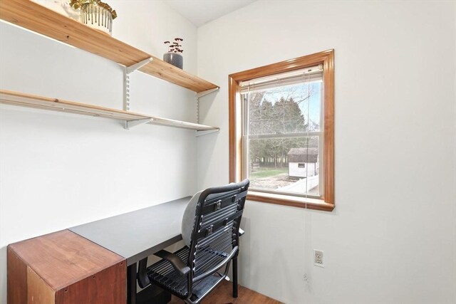 home office with wood finished floors