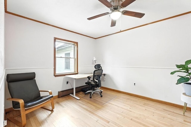 office featuring ceiling fan, baseboards, ornamental molding, and light wood-style flooring