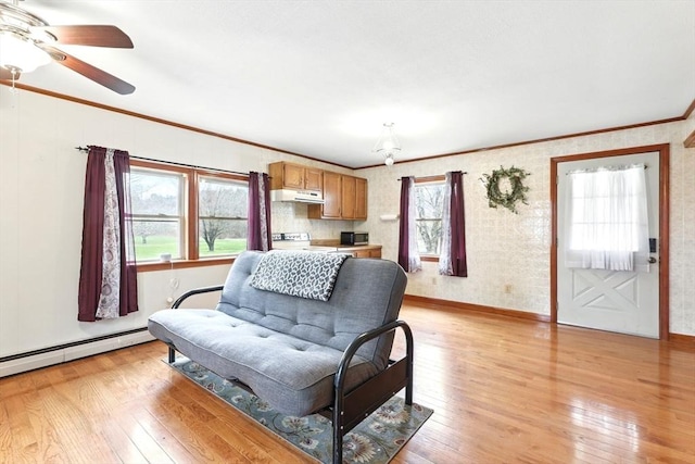 living area featuring crown molding, ceiling fan, a baseboard radiator, and light wood-style floors