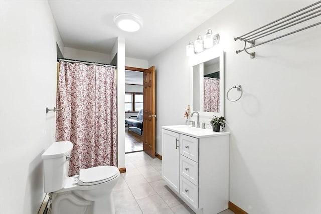 bathroom with toilet, tile patterned flooring, and vanity