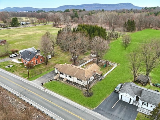 drone / aerial view featuring a mountain view and a rural view