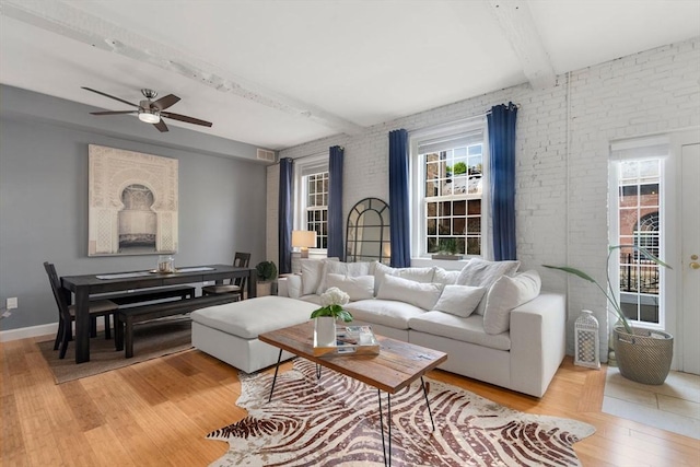 7 S Stone Mill Dr Unit 403, Dedham, MA 02026 - living room with beamed ceiling, ceiling fan, light wood-type flooring, brick wall, and baseboards