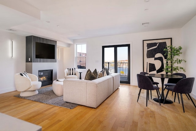 living room with light hardwood / wood-style flooring