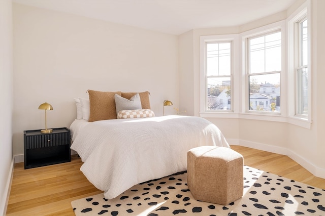 bedroom with light hardwood / wood-style flooring