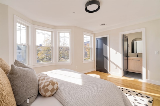 bedroom with light hardwood / wood-style flooring