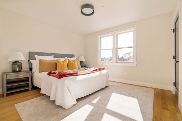 bedroom with light hardwood / wood-style flooring