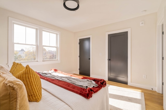 bedroom with light hardwood / wood-style floors