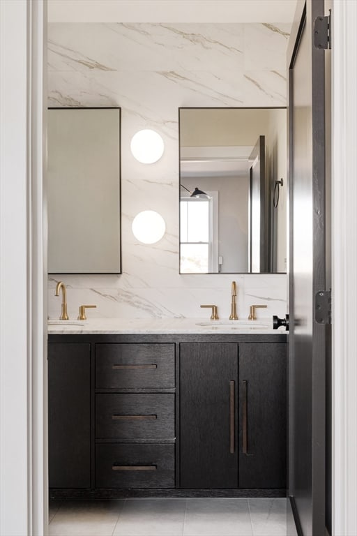 bathroom with tile patterned floors, vanity, and backsplash