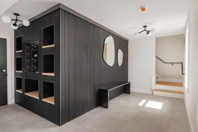 corridor with light tile patterned floors