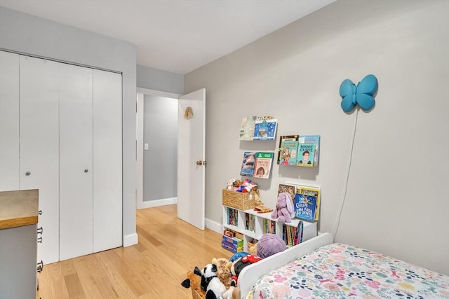 32 Juniper St Unit 91, Brookline, MA 02445 - bedroom with wood finished floors and a closet
