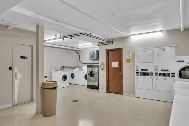 32 Juniper St Unit 91, Brookline, MA 02445 - basement with stacked washer / dryer and washing machine and clothes dryer