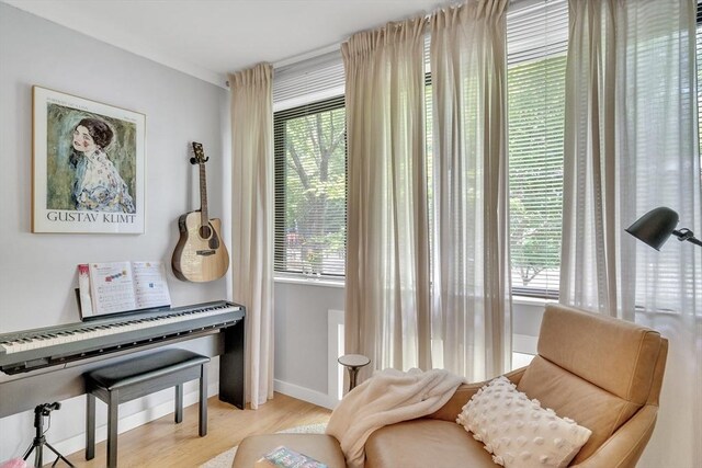 32 Juniper St Unit 91, Brookline, MA 02445 - sitting room featuring plenty of natural light and wood finished floors